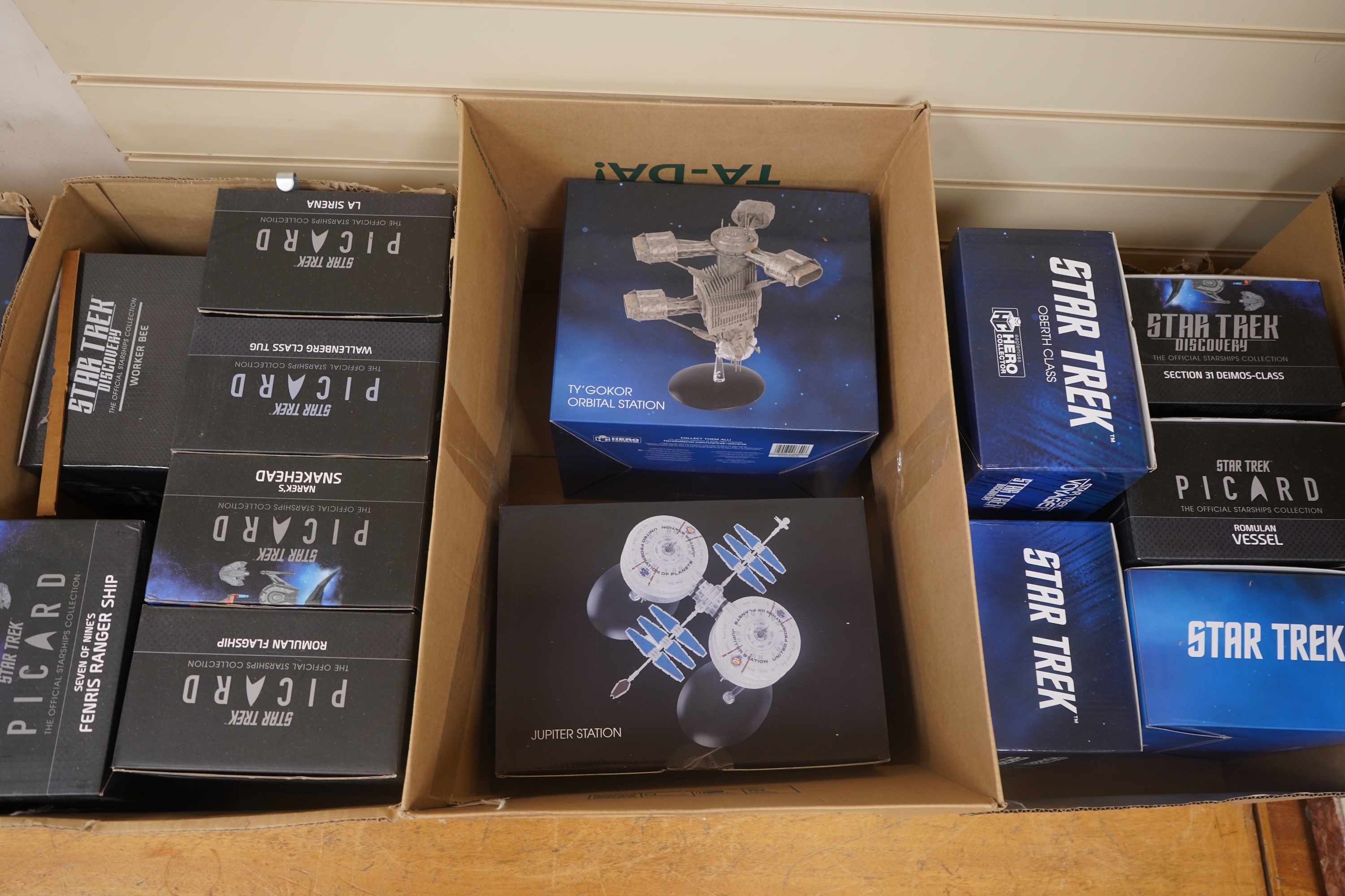 Eighteen boxed Eaglemoss Star Trek magazine issue models, including; a Vulcan Cruiser, a Klingon Qugh Class vessel, a Son’a Battleship, a Romulan Flagship, Jupiter Station, Ty’Gokor Orbital Station, etc. Condition - good
